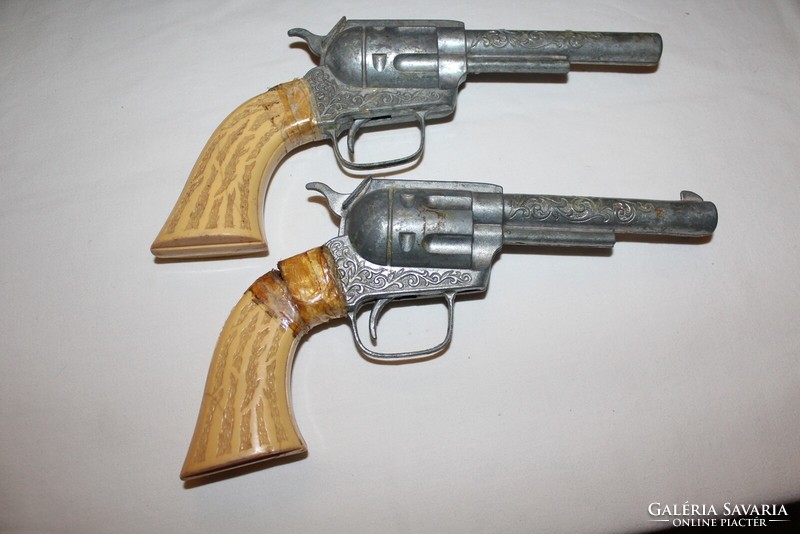 Old retro 2 toy pistols and accompanying pistol belt