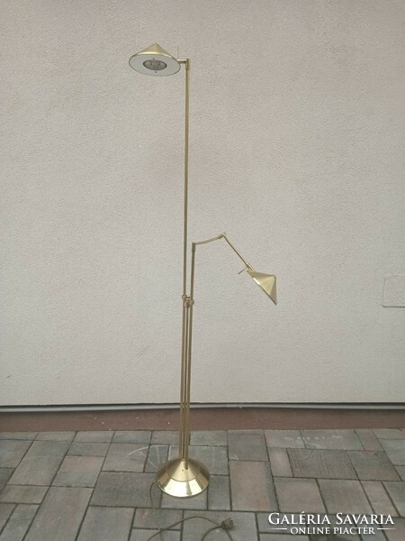 Modern design floor lamp with adjustable arm. Negotiable.