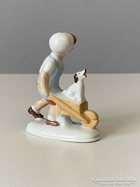Singing dog wheelbarrow boy painted porcelain figure 8.5 Cm