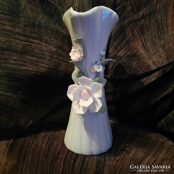 Porcelain vase with plastic flower decorations