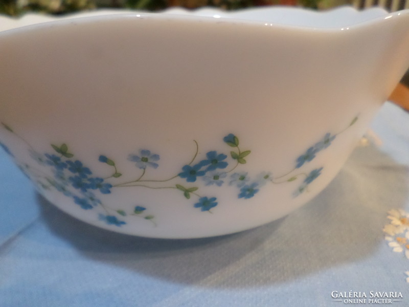 Milk glass bowl with a Jena face in a circle with a flower pattern