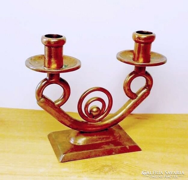 Copper candle holder. A work of applied art, a rarity in a rustic environment