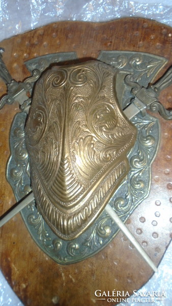 Old knight's metal shield with figured swords