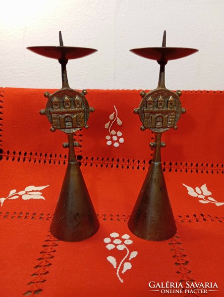 A pair of retro copper candle holders with the coat of arms of Budapest