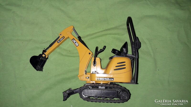 German bruder mini muna machine excavator in very nice condition, micro -jcb 8010 20 x 18 cm as shown in the pictures