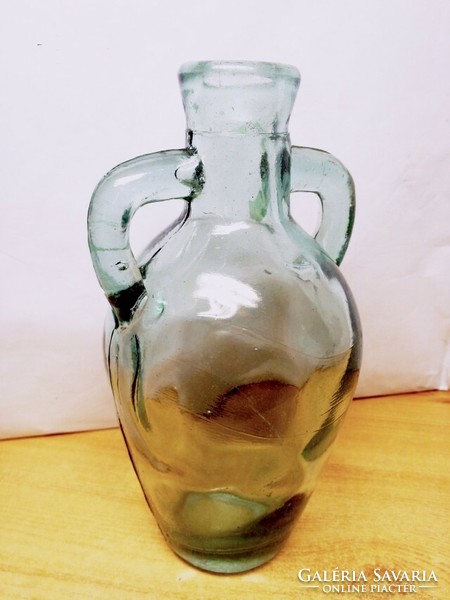Antique amphora-shaped bottle with a molded ear with bubble inclusions