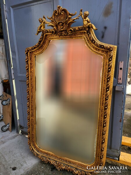 Gilded French mirror with putto decoration