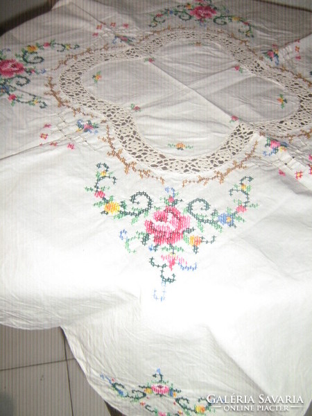 Beautiful crocheted rose tablecloth embroidered with tiny cross stitches