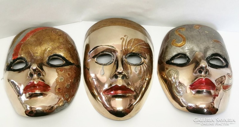 Bronze wall mask trio with enameled decoration, polished. An Indian rarity