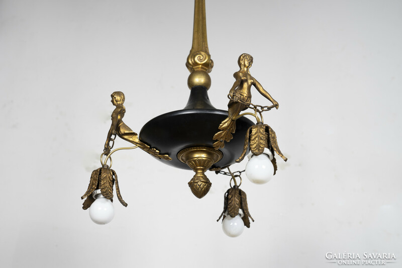 Empire style chandelier decorated with gilded female torsos