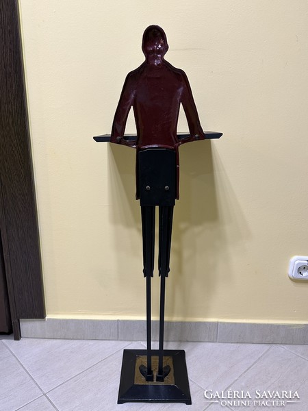 Antique restaurant waiter made of metal, figure holding an ashtray