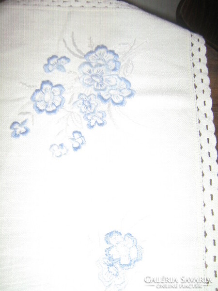 Beautiful blue floral hand embroidered woven tablecloth with lacy edges