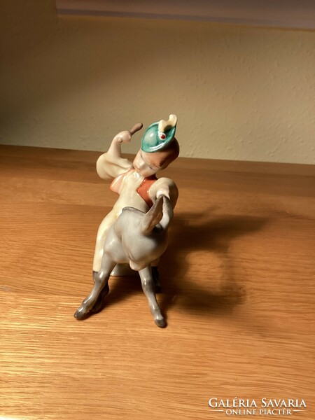 Herend porcelain boy sitting on a donkey.