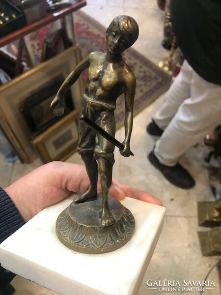 Boy playing pentaquet, bronze statue, height 15 cm.