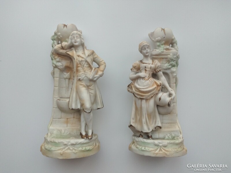 Pair of biscuit porcelain candle holders
