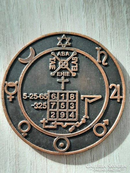 Mythological bronze amulet with symbols