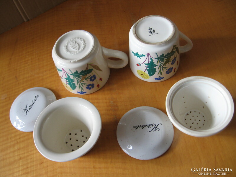 A pair of mugs with herbs and wildflowers, a pair of waechtersbach ceramic filter mugs with a lid