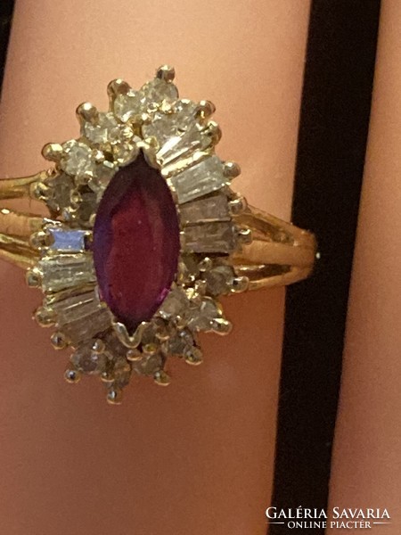 14K gold ring embellished with diamonds and ruby gemstones