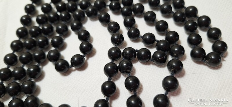 Long string of black pearls