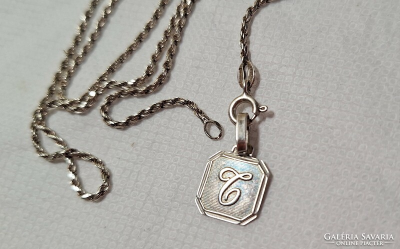 Twisted silver necklace with monogram pendant