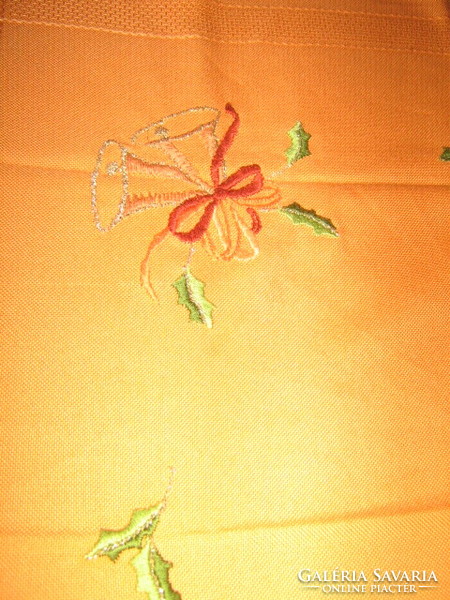 Wonderful Christmas bell with hand embroidered orange tablecloth