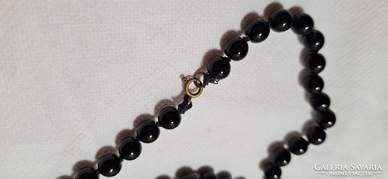 Long string of black glass beads