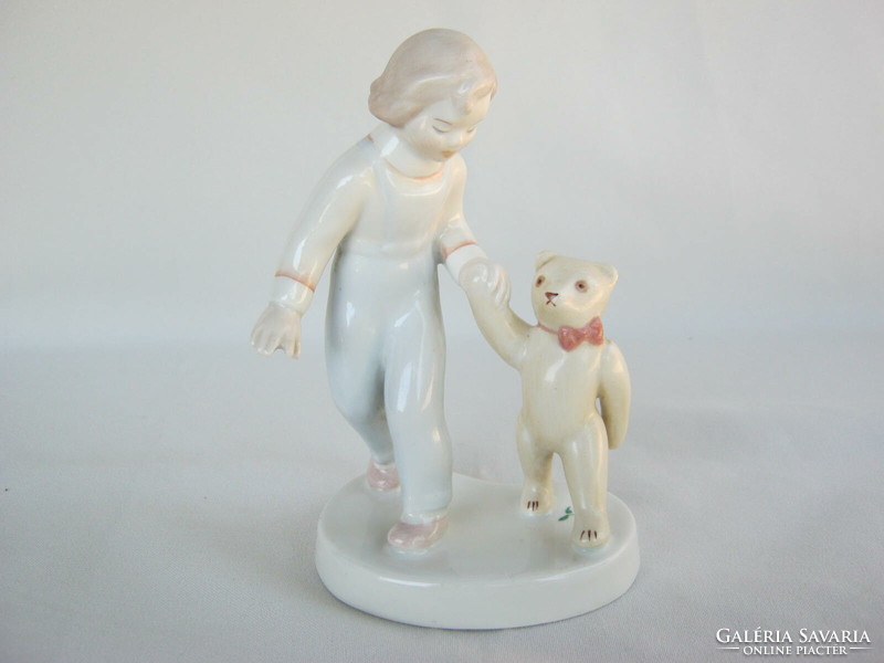 Porcelain little girl in Aquincum with teddy bear