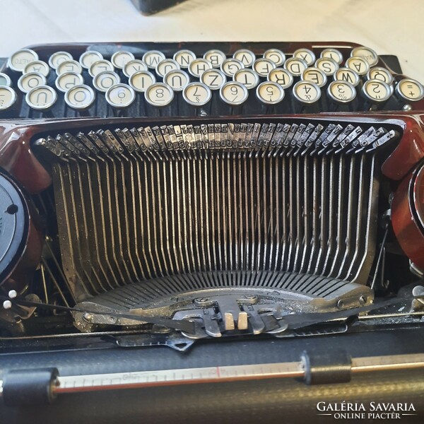 Antique burgundy-gold continental 340 typewriter with original box and cleaning brush