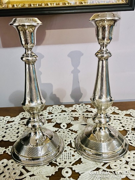 Pair of antique chiseled silver candle holders