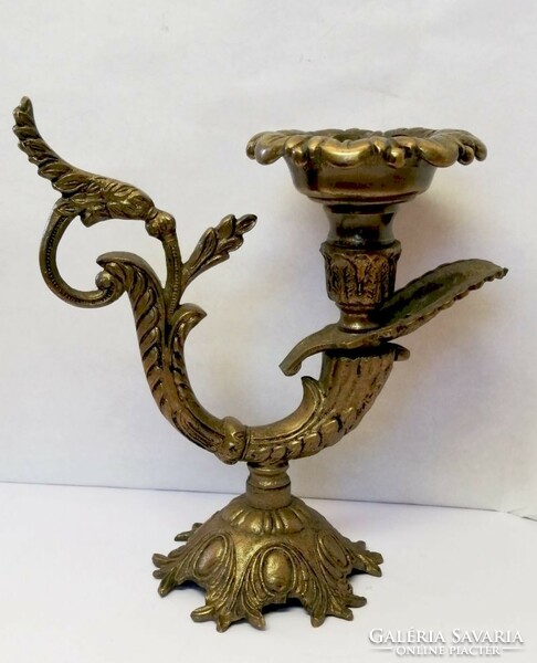 Baroque style bronze candle holder with characteristic decoration. from France