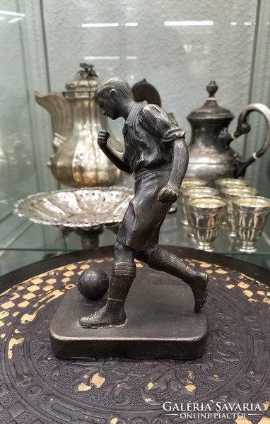 Antique bronze statue of a football player