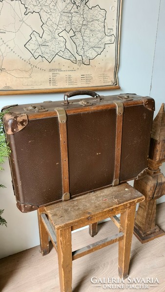 Old suitcase with wooden overlay