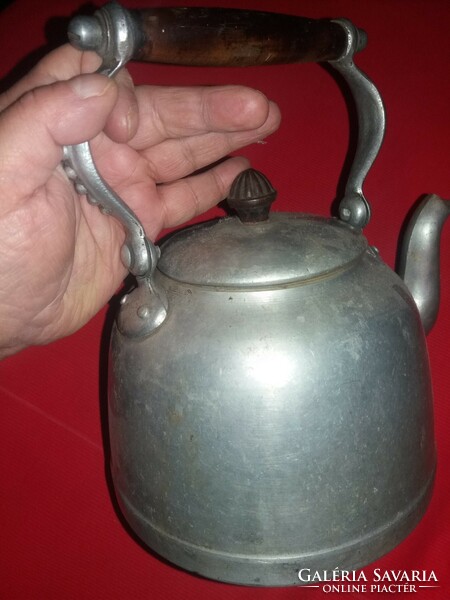 Antique art nouveau teapot with wooden handle and vinyl roof handle in good condition as shown in the pictures