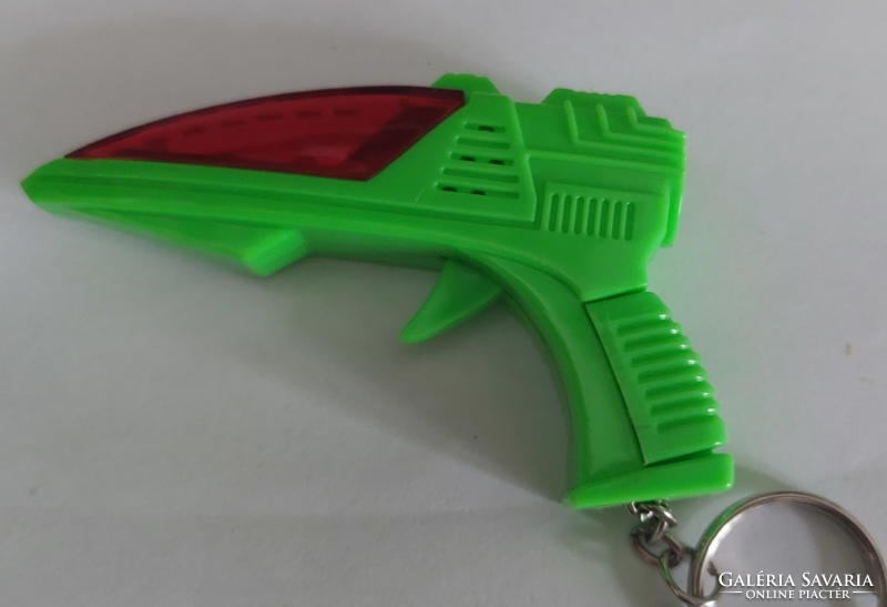 For collectors! Vintage, retro, button-operated, laser light and sound toy gun keychain, approx. 1970.