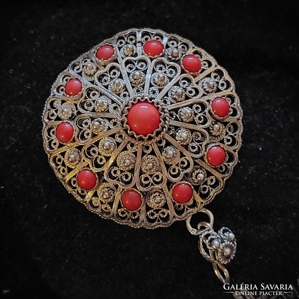 Old filigree silver pendant with coral stones