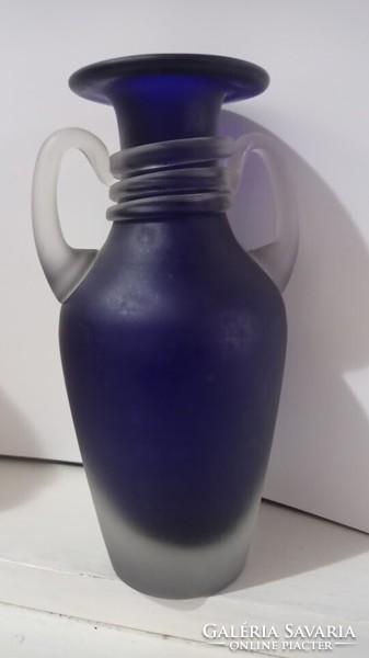 A blue Murano glass vase is a stylish glass vase with two handles