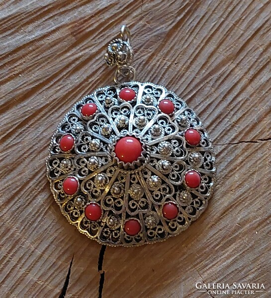 Old filigree silver pendant with coral stones