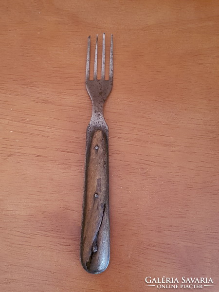 Very old fork with wooden handle
