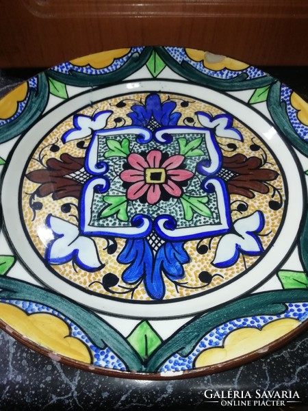 A marked wall plate from a collection has a small damage, it is in the condition shown in the pictures