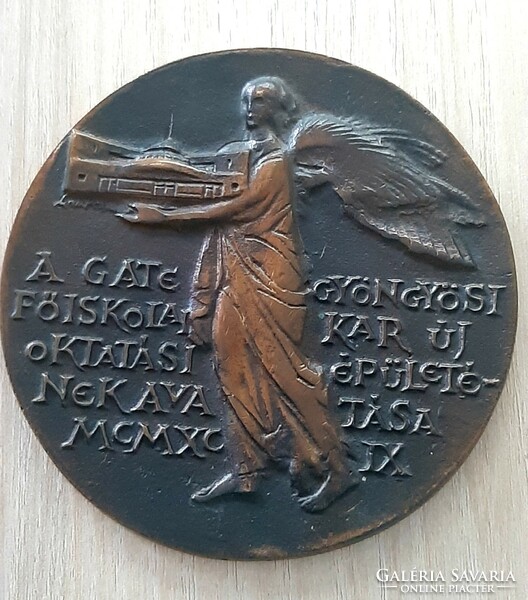 A bronze commemorative plaque marking the inauguration of the new educational building of the college faculty in Gate Gyöngyös