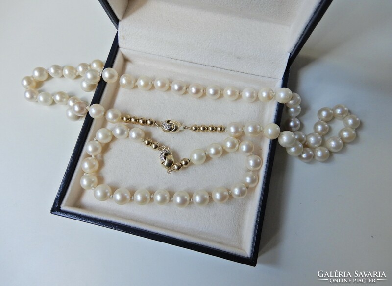 Genuine Akoya pearl jewelry set with 14 carat gold setting and diamonds