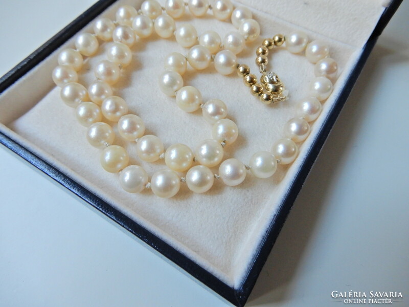 Genuine Akoya pearl jewelry set with 14 carat gold setting and diamonds