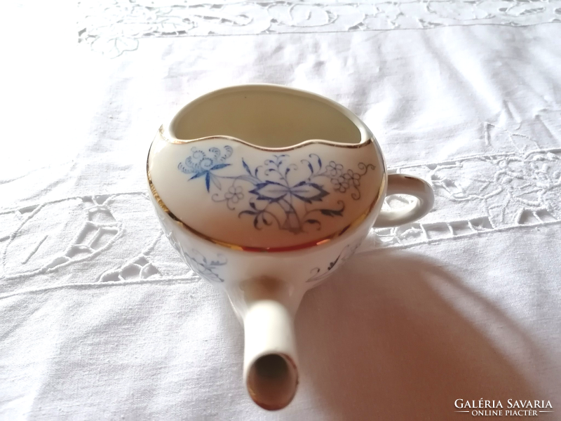 Old, onion-patterned porcelain nursing cup