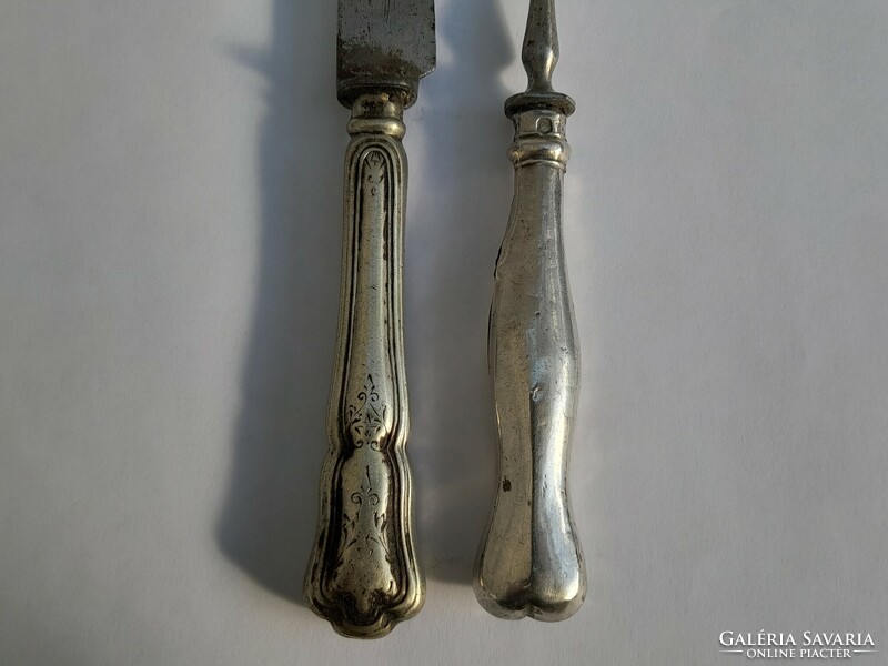 Silver-handled knife and fork in one