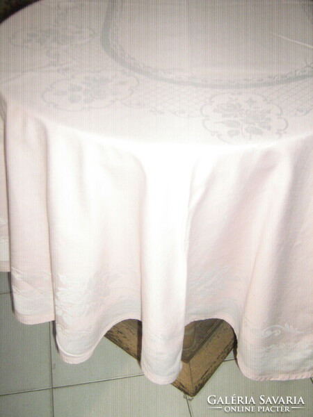 Beautiful pink oval damask tablecloth with a rose pattern