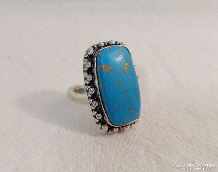 Old silver ring with huge turquoise