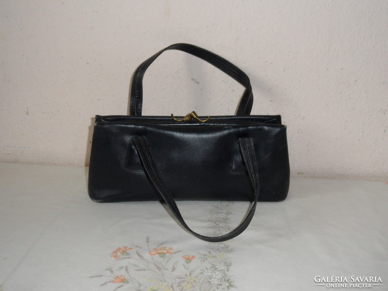 Old blue leather radish in women's bag