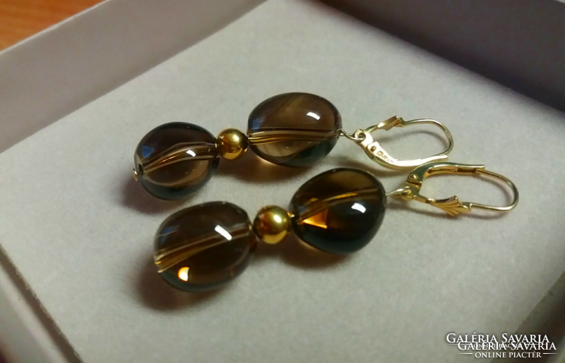 14th century Gold earrings with smoky topaz spheres.