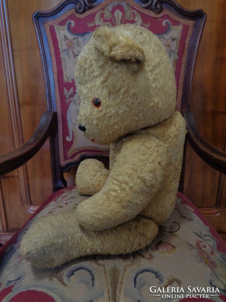 Large teddy bear stuffed with straw