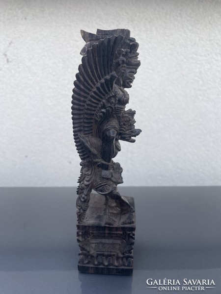 Eastern v. South American deity, richly carved wooden statue